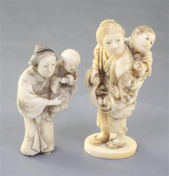 Two small Japanese ivory okimono of a mother and child, 19th century, height 6.4 and 7.9cm